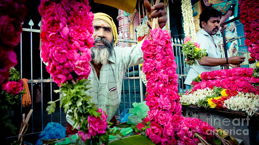 Man with Flowers near the temple Kerala YATRA 2016 Yantra Photograph by Raimond Klavins