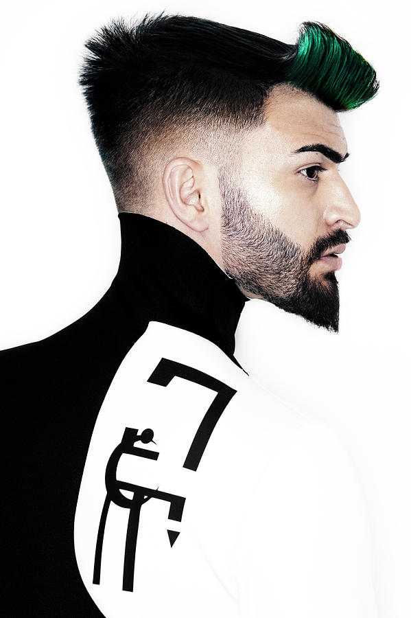 Man With High Fade Quiff Haircut In Black And White Outfit