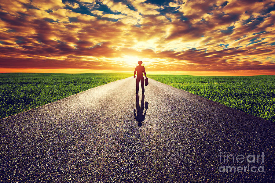 Man with suitcase and hat on long straight road towards sunset sky Photograph by Michal Bednarek