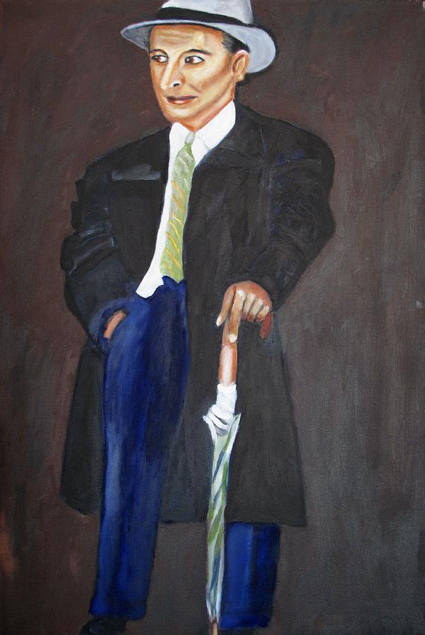 man with umbrella painting