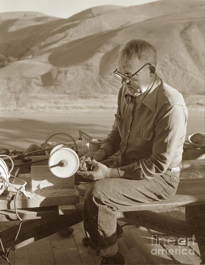 Botryoidal Photograph - Man working on a piece of Botryoidal jade from the Big Sur Coast by Monterey County Historical Society