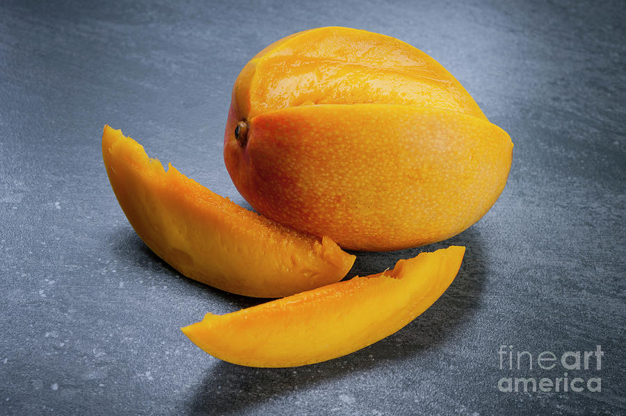 Mango Photograph - Mango and slices by Elena Elisseeva