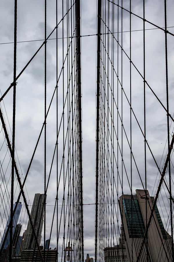 Manhattan Skyline Seen Through Brooklyn Bridge Cables Photograph by Robert Ullmann