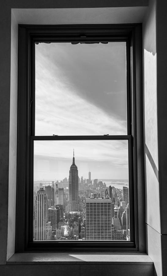 Manhattan through window Photograph by John McGraw
