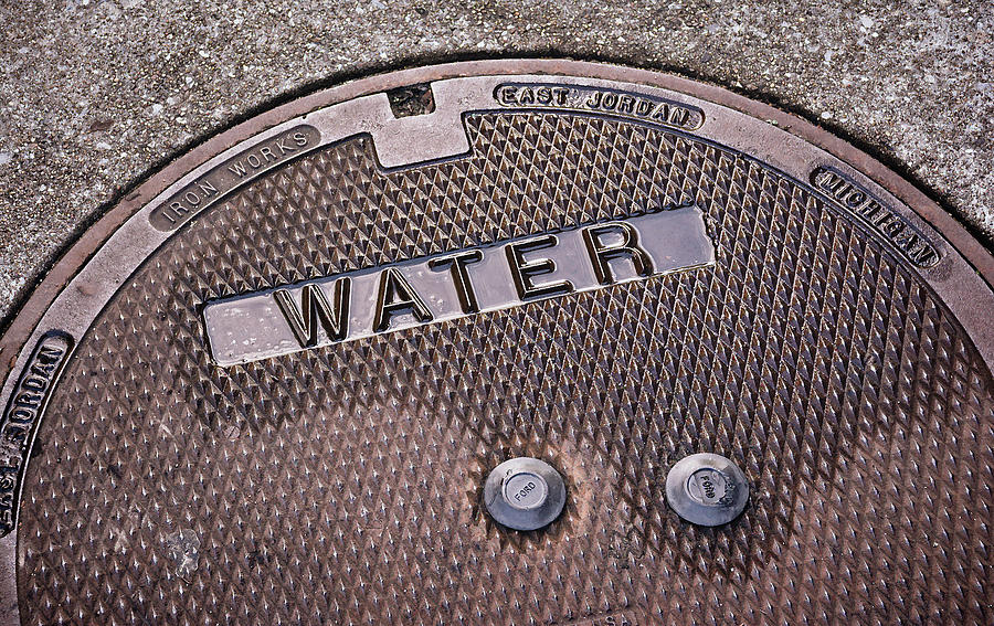 Greg Jackson Photograph - Manhole Cover - Water by Greg Jackson