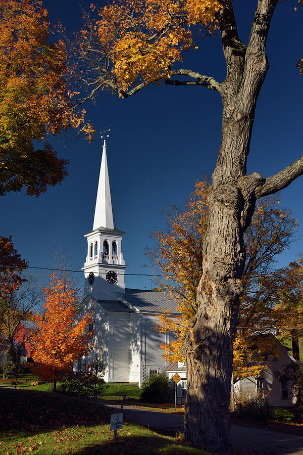 Maple trees and white church with clock tower in Peacham Vermont ...