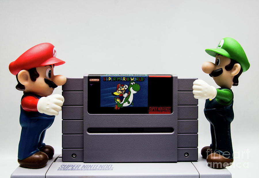 Mario Photograph - Mario and Luigi putting Super Mario World in SNES by Toro The Bull - Arturelia