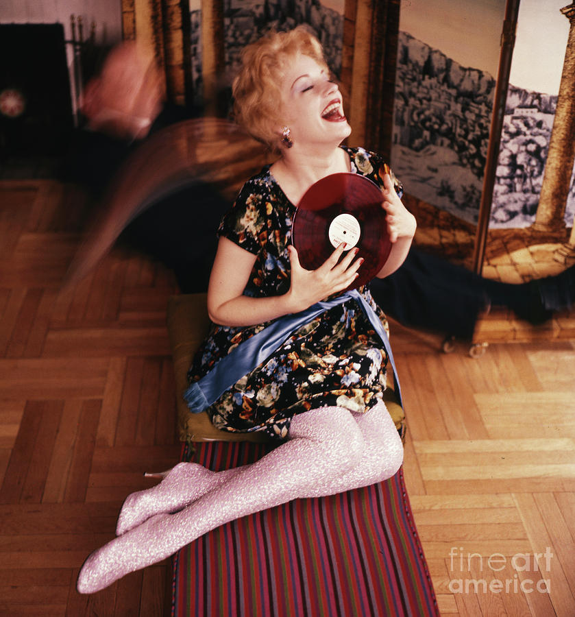 Mary Ure, actress, holding a vinyl LP recording, 1958  Photograph by The Harrington Collection