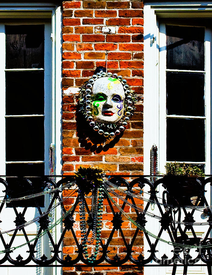 Mardi Gras Mask On The Brick Wall Photograph by Frances Ann Hattier