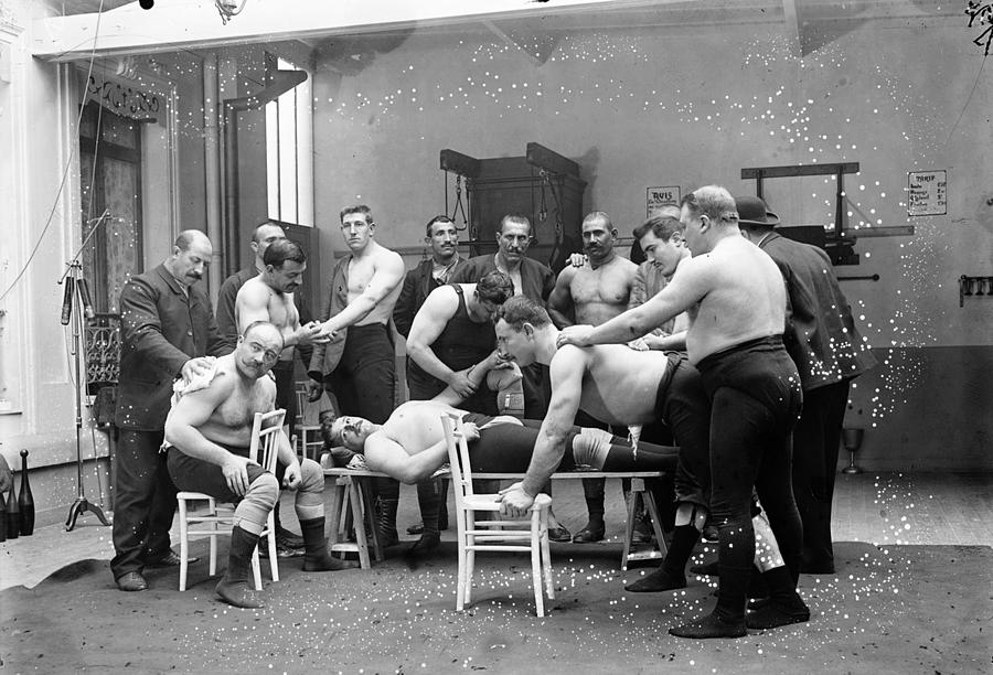 Massage between wrestlers training 1904 Photograph by Vincent Monozlay