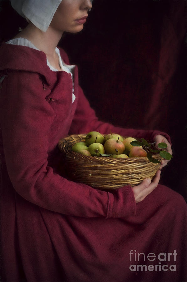 Medieval Woman Holding A Basket Of Apples Photograph by Lee Avison