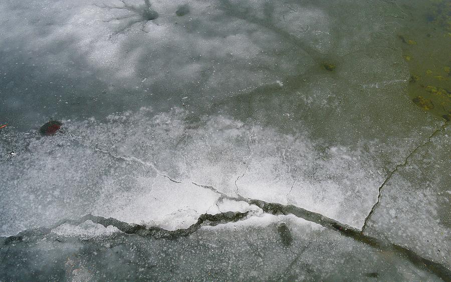 Melting Cracking Ice Photograph by Lyle Crump