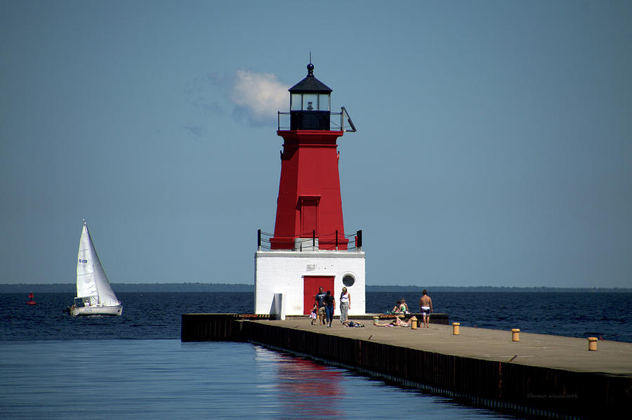 Menominee Pierhead Lighthouse Wisconsin With Sail Boat Photograph by Thomas Woolworth
