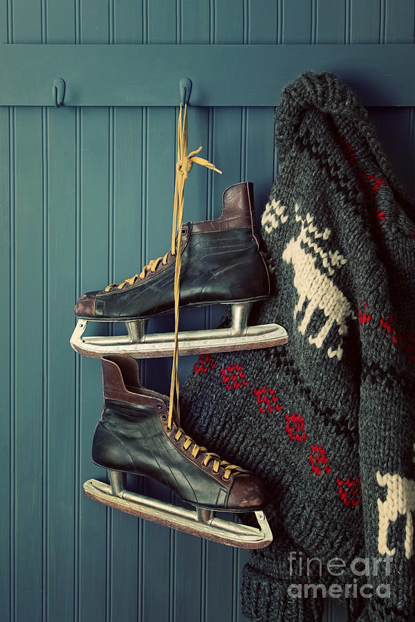Mens vintage skates  and sweater hanging on hooks Photograph by Sandra Cunningham