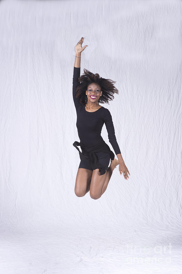 Mercedes dancer modeling in studio jumping Photograph by Dan Friend