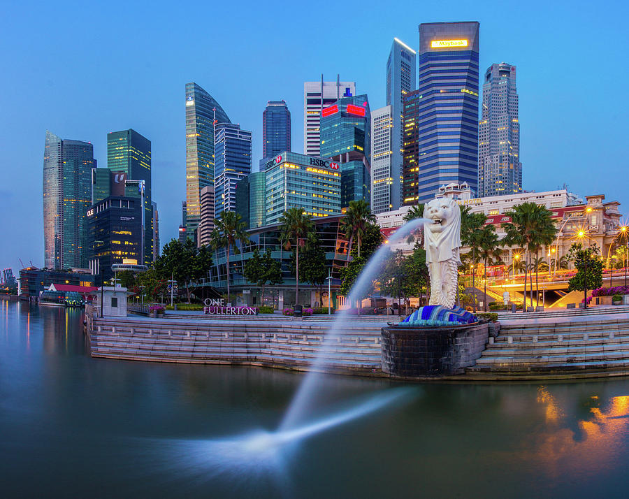 Merlion and Singapore city Photograph by Anek Suwannaphoom