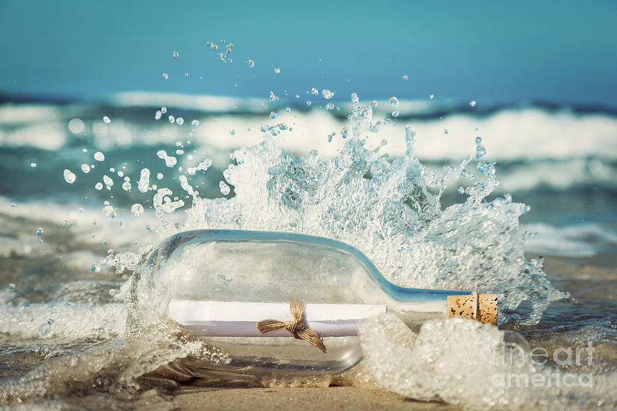 Message in the bottle coming with wave from ocean Photograph by Michal Bednarek