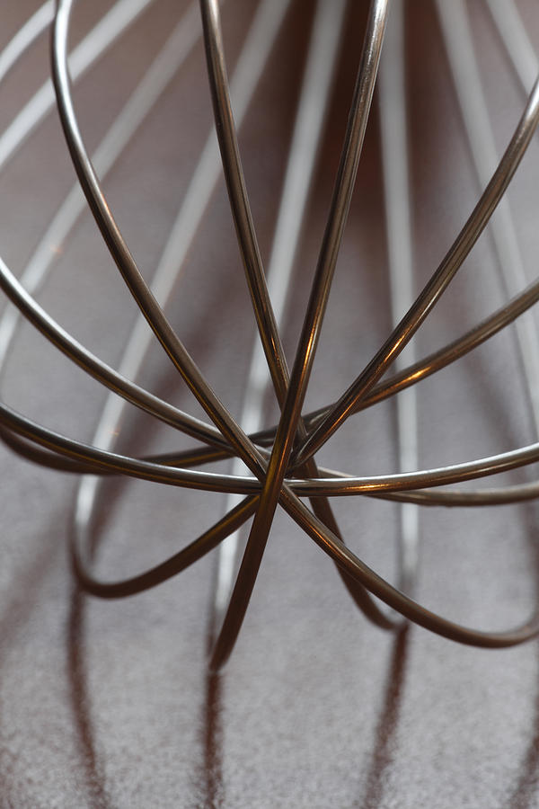 Metal whisk on a table Photograph by Ulrich Kunst And Bettina Scheidulin