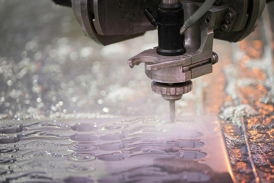 Metalworking cutting with water jet Photograph by Anek Suwannaphoom