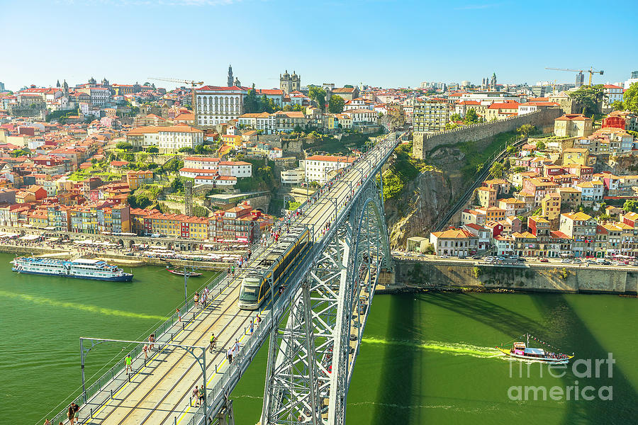 Metro train over Porto Bridge Photograph by Benny Marty