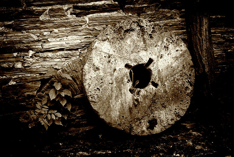 Mill Stone against wall Photograph by Paul W Faust - Impressions of Light