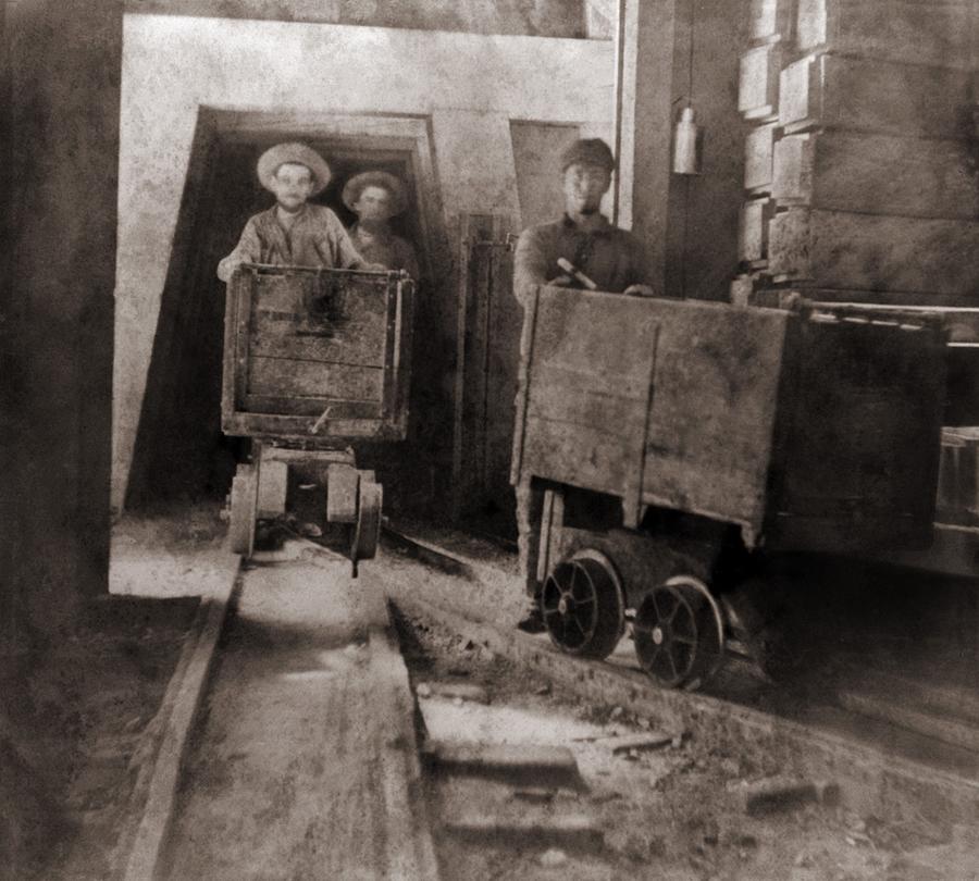 Miners Pushing Ore Carts Photograph by Everett