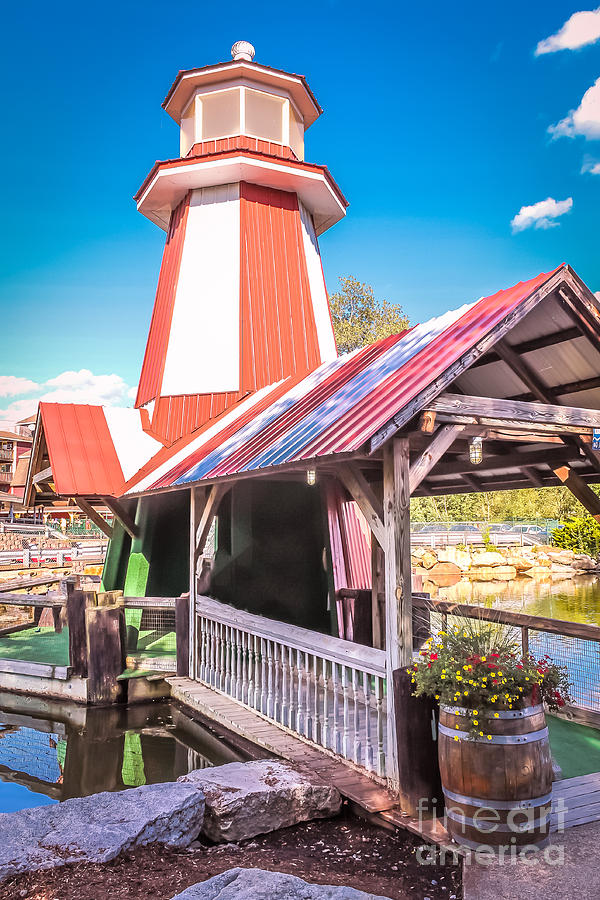 Minigolf miniature lighthouse and covered bridge Photograph by Claudia M Photography