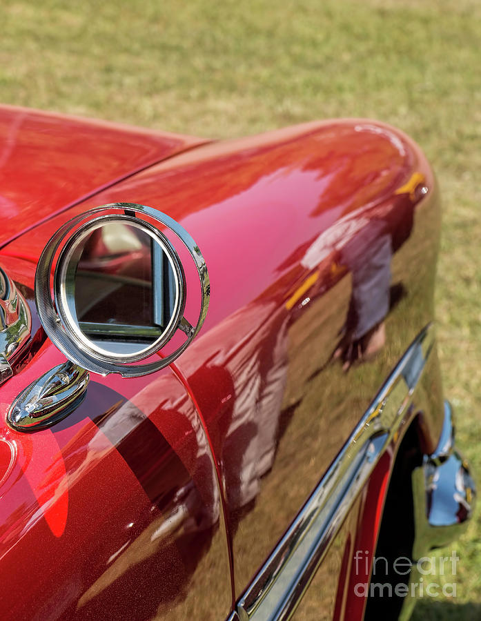 Mirror on a red classic car Photograph by Les Palenik