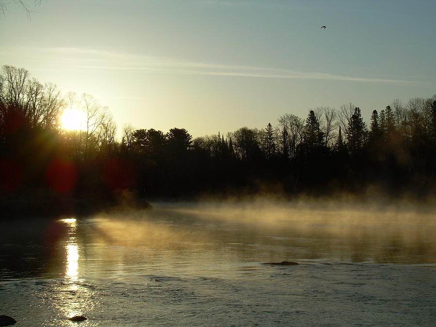 Mississippi river Dawn light rays Photograph by Kent Lorentzen