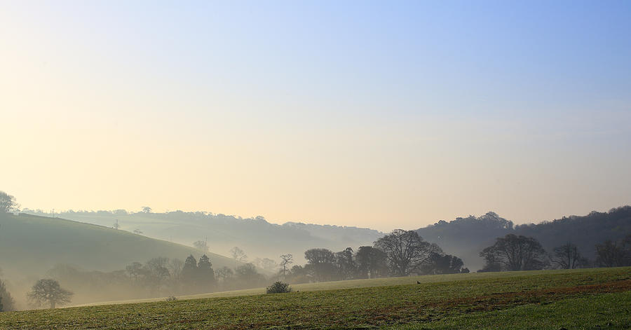 Misty dawn over the Cornish countryside Photograph by Tony Mills