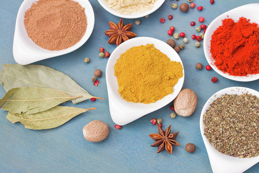Mix of Spices on Blue  Table Photograph by Anastasy Yarmolovich