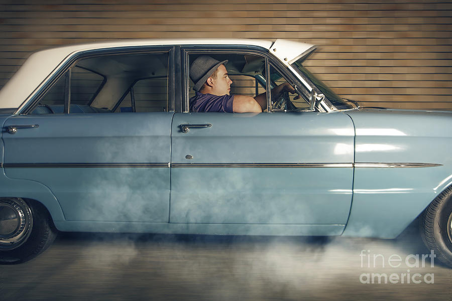 Mobster man from 1950 driving getaway car Photograph by Jorgo Photography