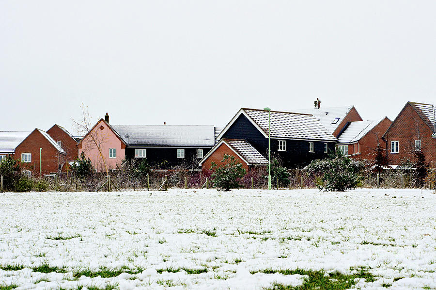 Modern homes in the snow Photograph by Tom Gowanlock
