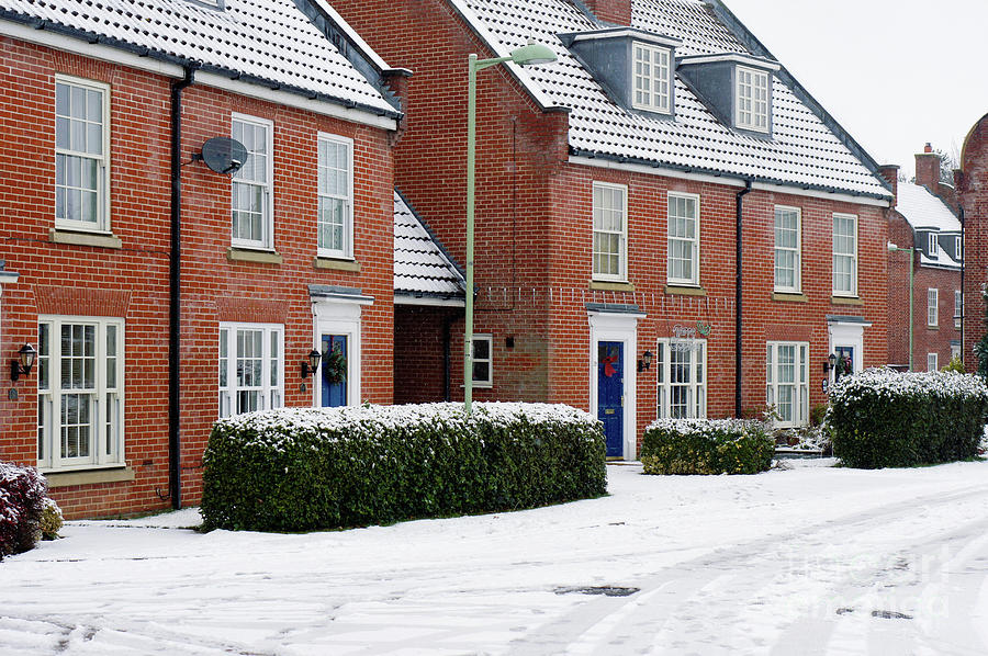 Modern houses in the snow Photograph by Tom Gowanlock