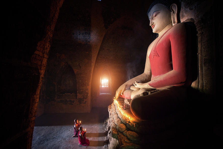 Monk in Bagan old town pray a buddha statue  Photograph by Anek Suwannaphoom
