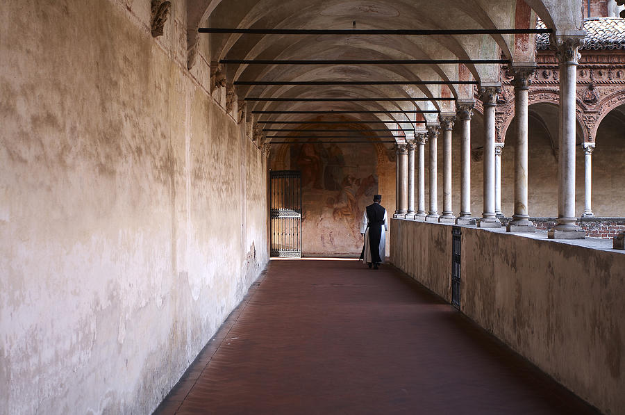 Monk walking in the cloister Photograph by Roberto Pagani