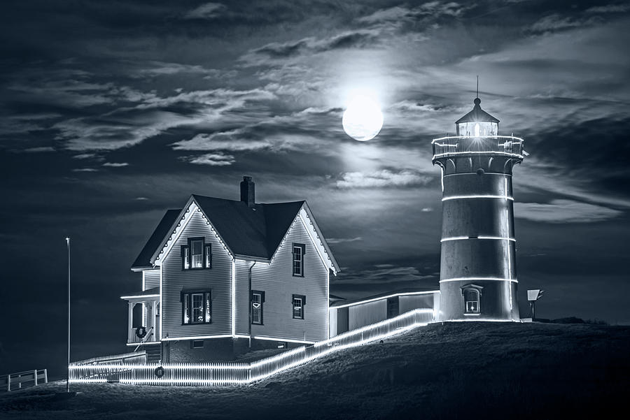 Monochrome Blue Nights The supermoon rising over the Nubble Lighthouse York Maine Photograph by Toby McGuire