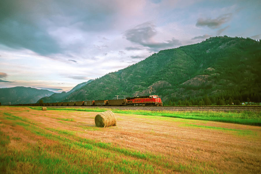 Montana landscapes with heavy train engine locomotive passing Photograph by Alex Grichenko