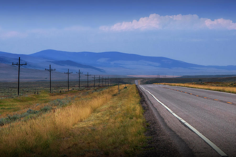 Montana Road Highway running through the  Mountain Foothills near Yellowstone Photograph by Randall Nyhof