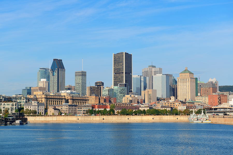 Montreal city skyline over river  Photograph by Songquan Deng