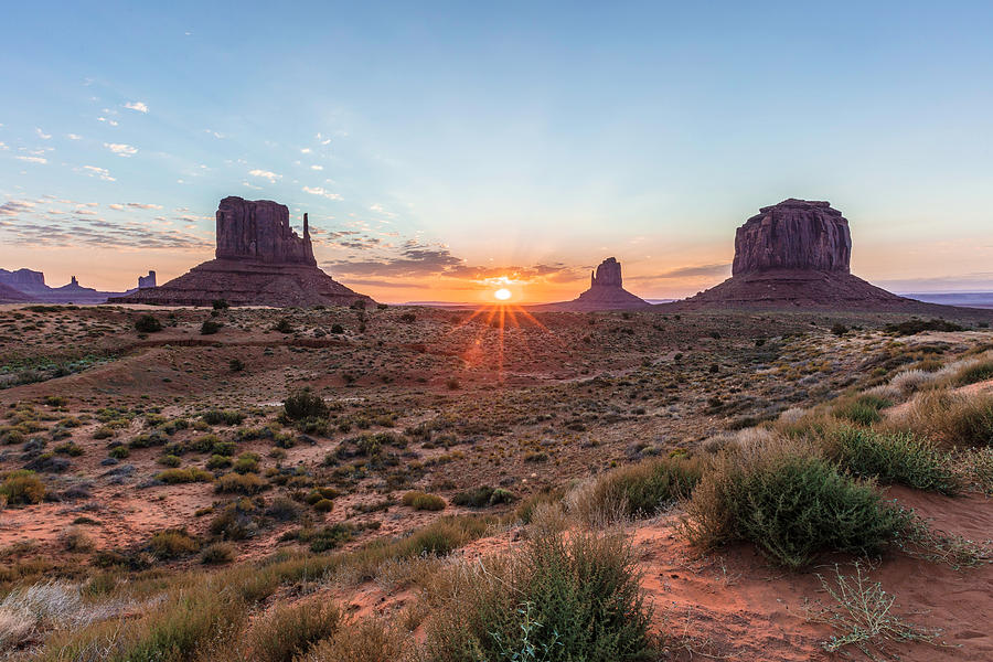 Monument Valley Sunrise peaking through Photograph by John McGraw