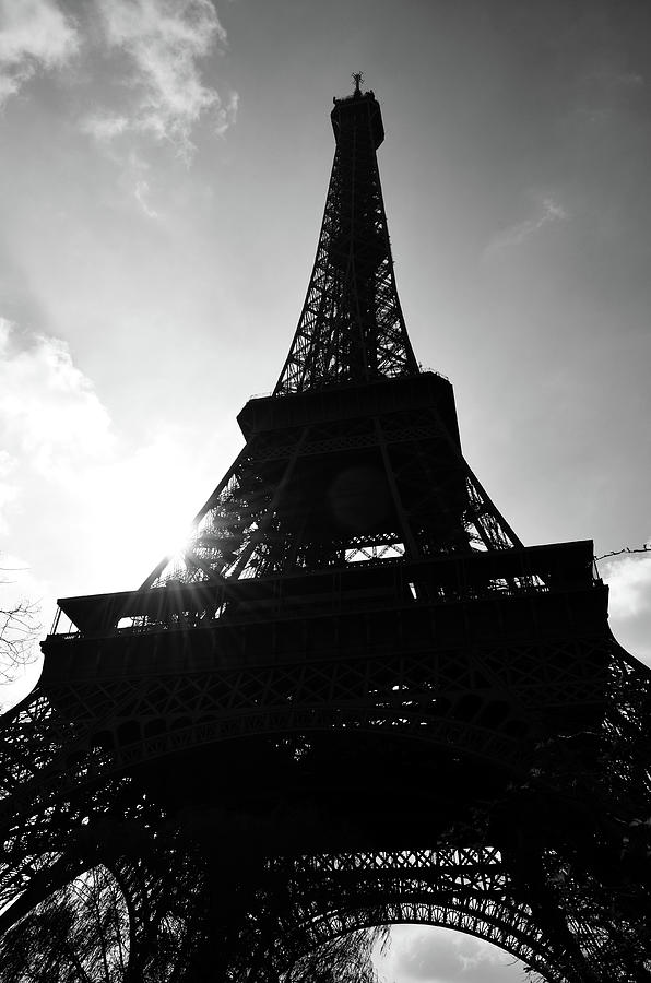 Moody Eiffel Tower Silhouette Backlit by Sun with Lens Flare Paris France Black and White Photograph by Shawn OBrien