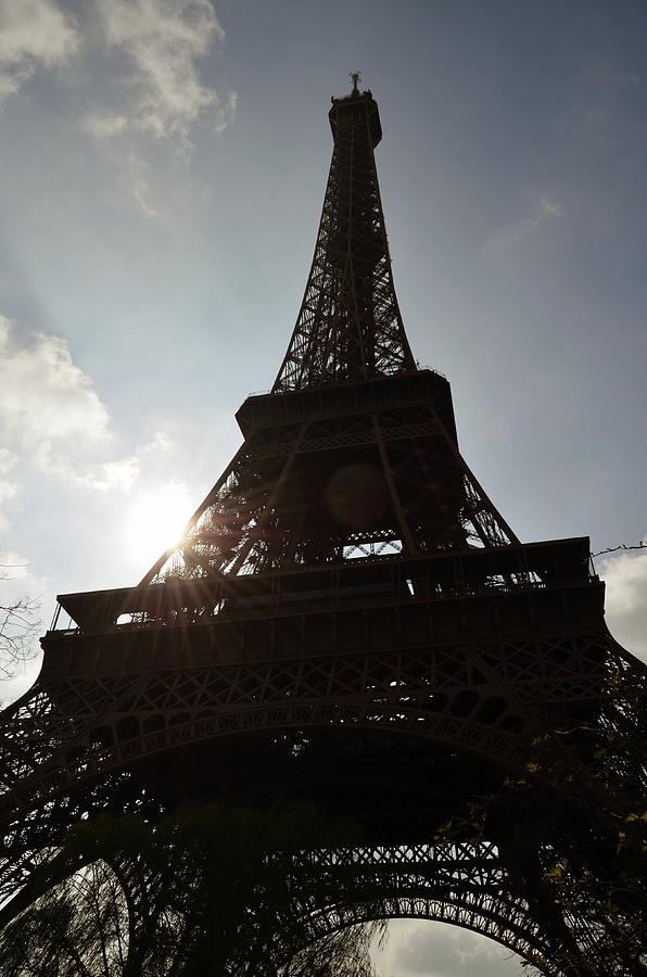 Moody Eiffel Tower Silhouette Backlit by Sun with Lens Flare Paris France Photograph by Shawn OBrien