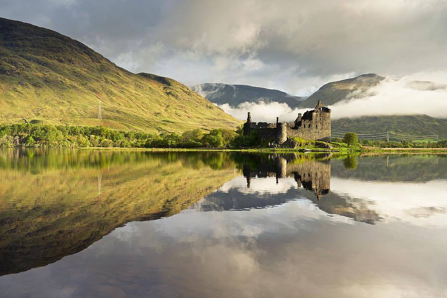 Moody skies over Kilchurn castle Photograph by Stephen Taylor