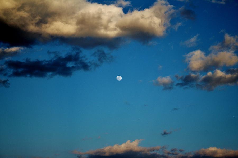 Moon Between The Clouds Photograph by Cynthia Guinn