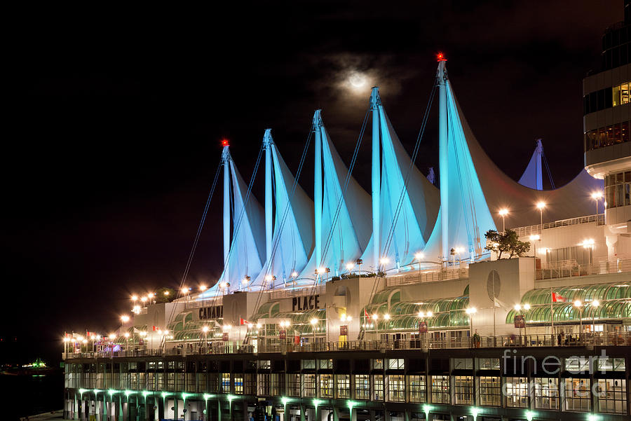 Moon over Canada Place in Vancouver Photograph by Maria Janicki