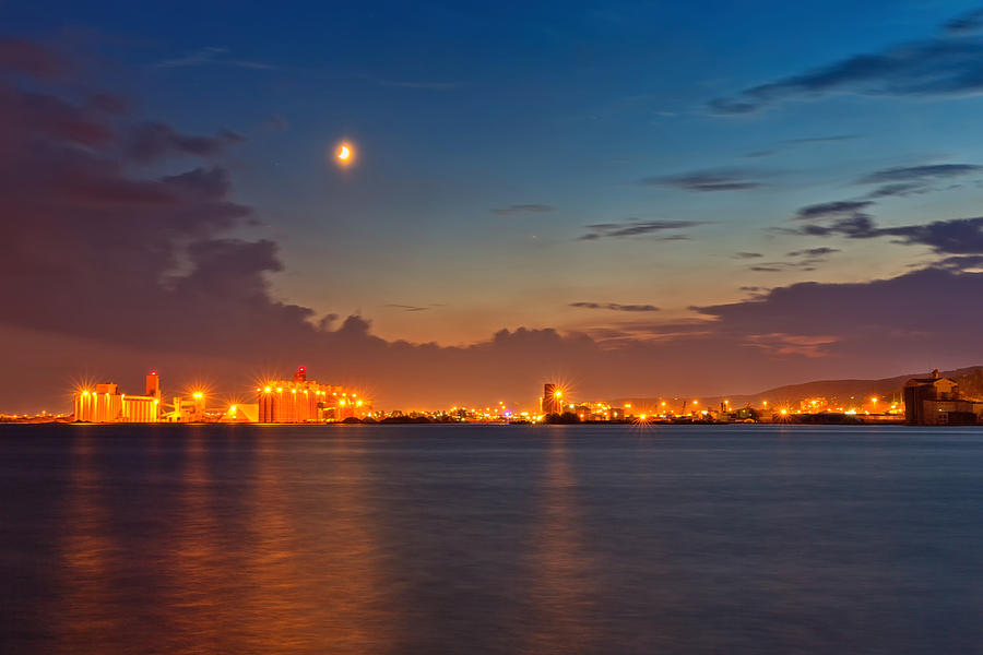 Moon Over Duluth Harbor Photograph by John M Bailey