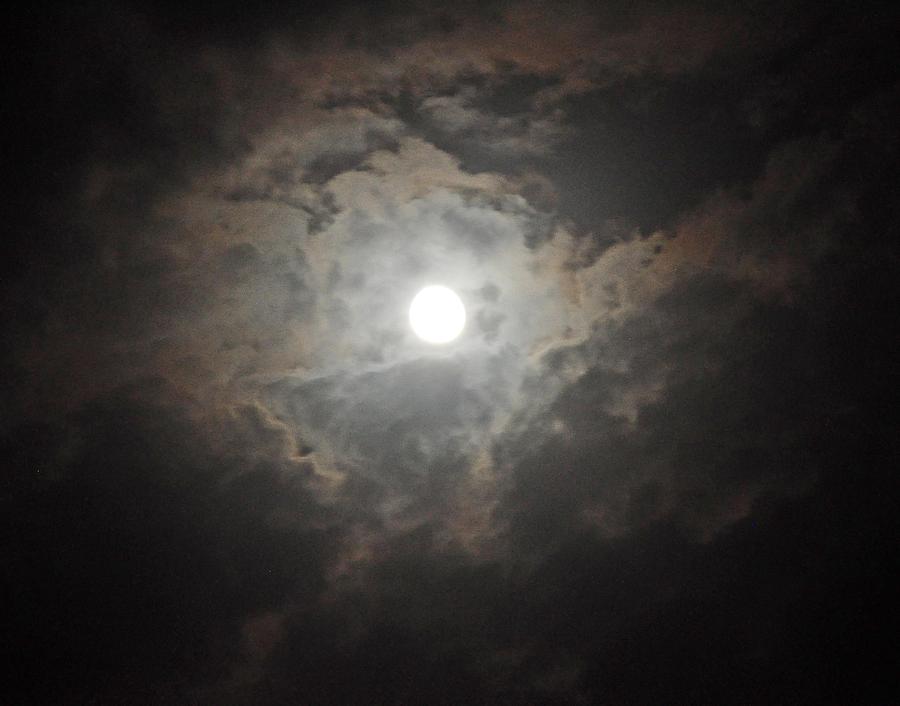 Moon Peeking Thru The Clouds Photograph by Jay Milo