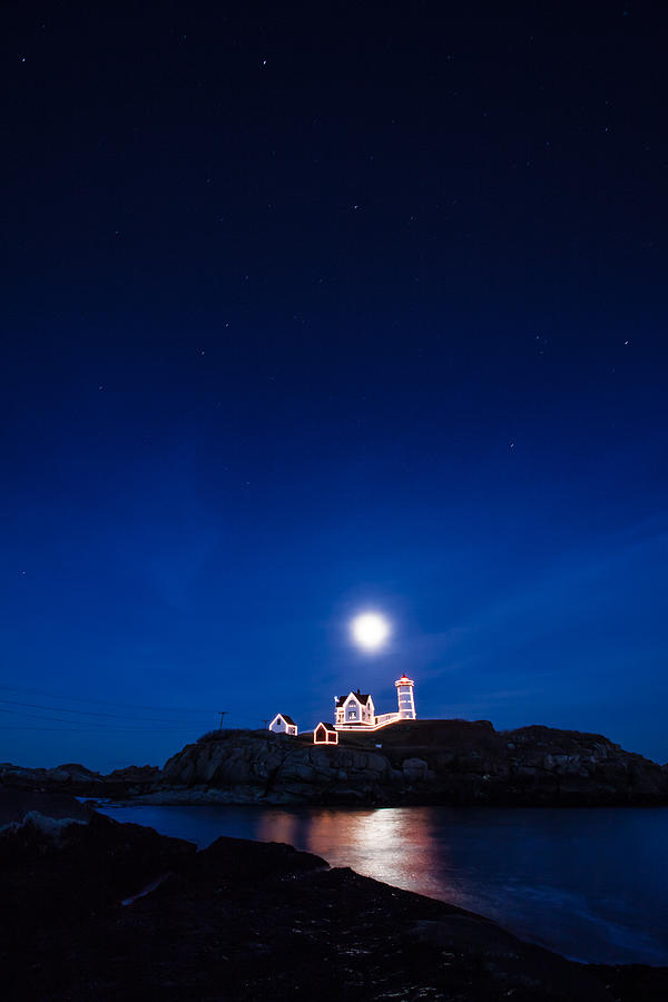 Moon rise Nubble Lighthouse Photograph by Jeff Folger