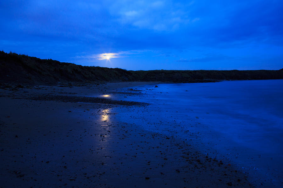 Moon rising over Whitley Bay Photograph by Ian Middleton